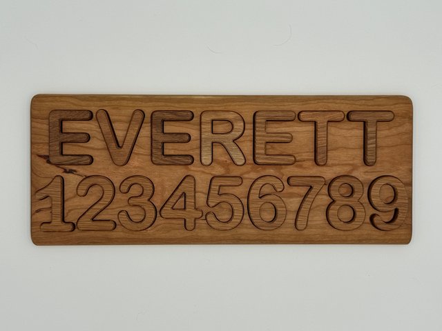 EVERETT and numbers 1–9, American Cherry board with White Oak pieces