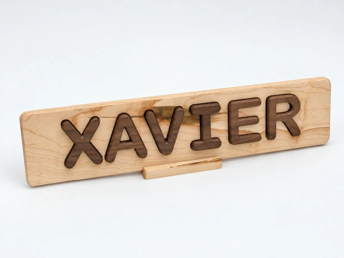 Personalized hardwood Xavier name puzzle with contrasting walnut letters and matching display stand
